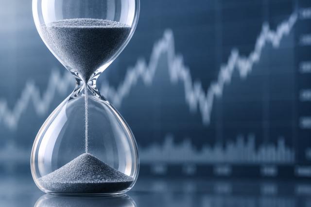 hourglass with chart in background